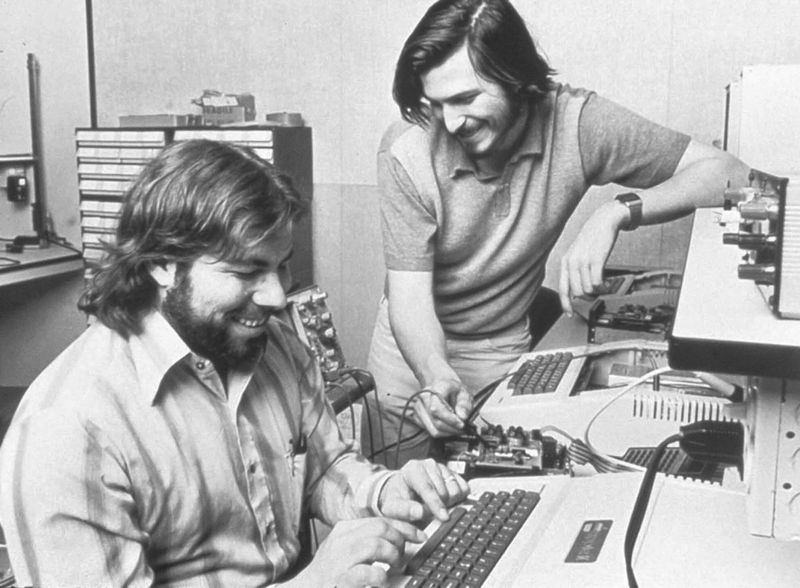 Steve Jobs and Steve Wozniak working