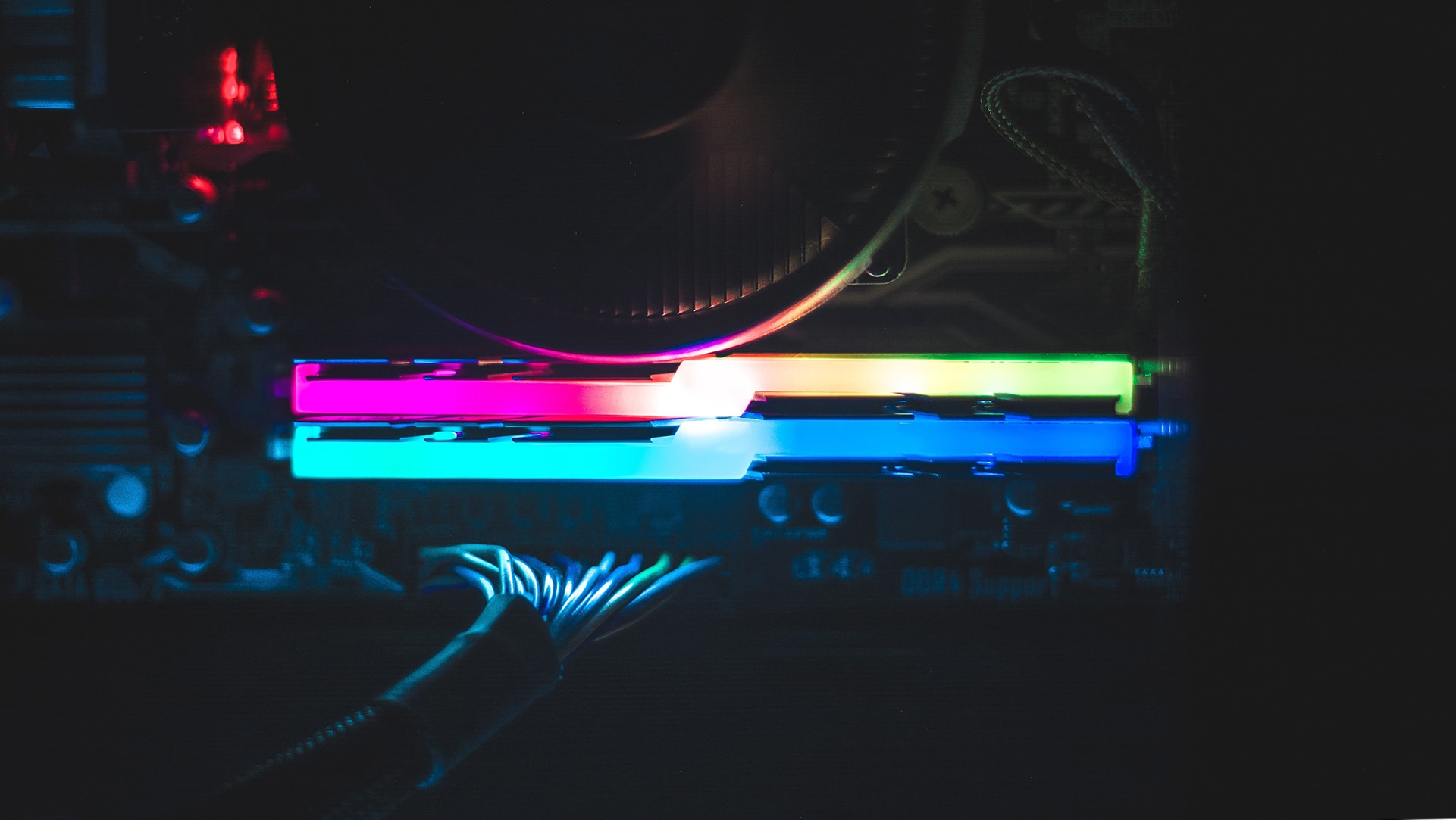 Close-up photo of computer hardward with colorful lights | Photo by Akshar Dave on Unsplash