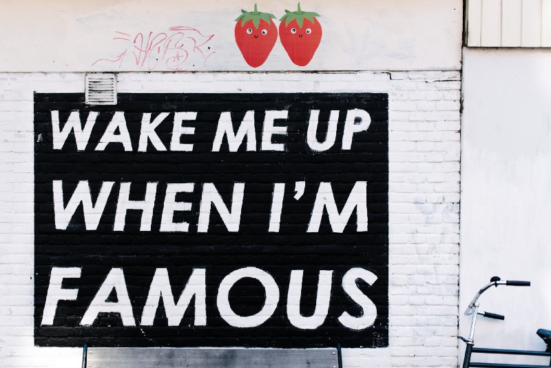 Roadside graffiti saying Wake me up when I am famous
