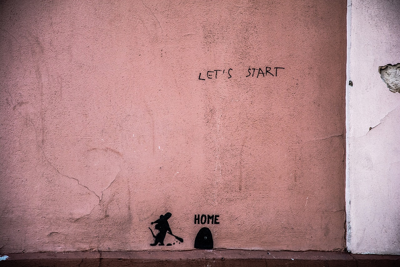 A purple wall with Let's Start written on it | Photo by Arūnas Naujokas on Unsplash