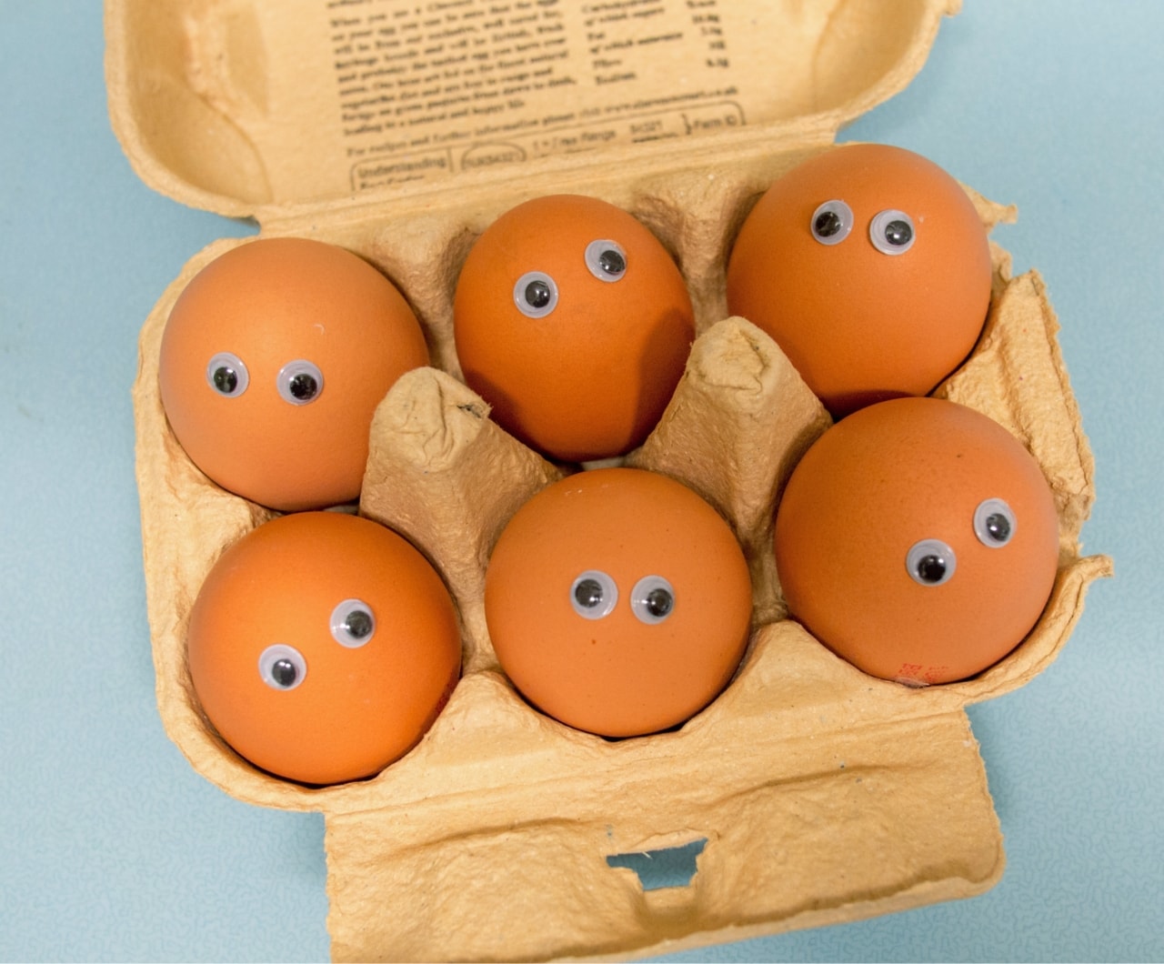 A clutch of egges with googly eyes