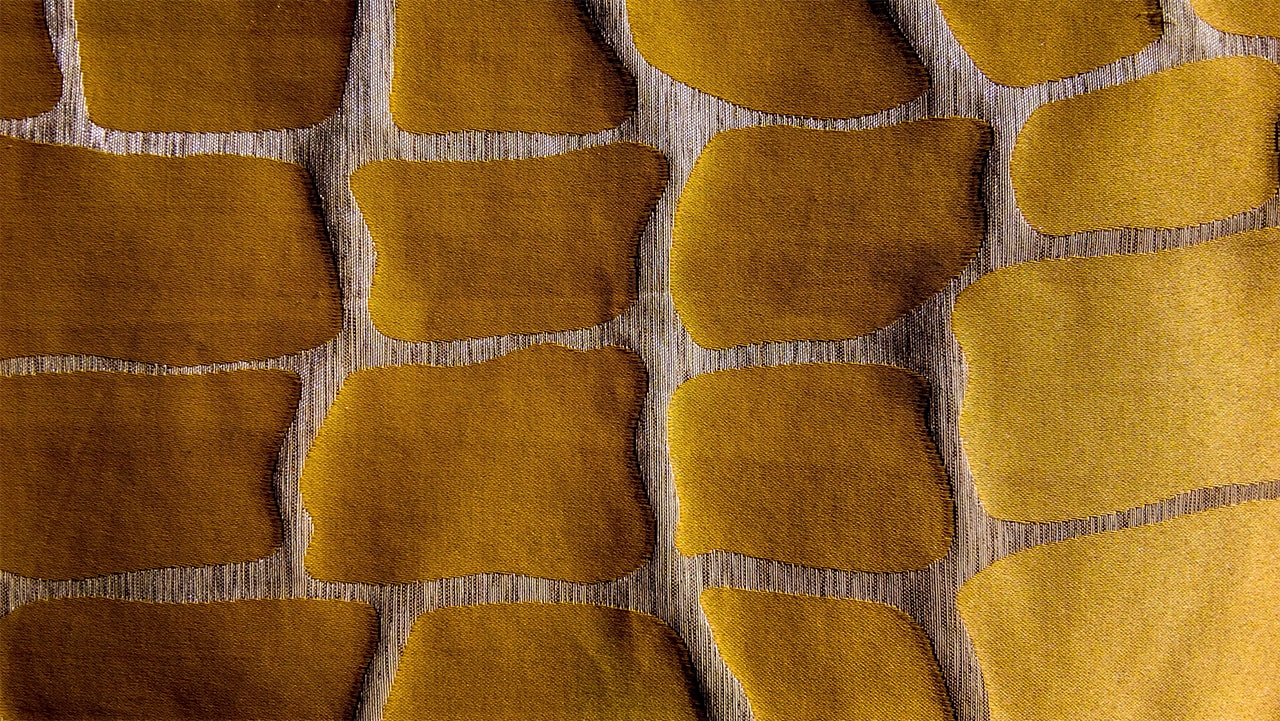 Patch like pattern in yellow color on a fabric