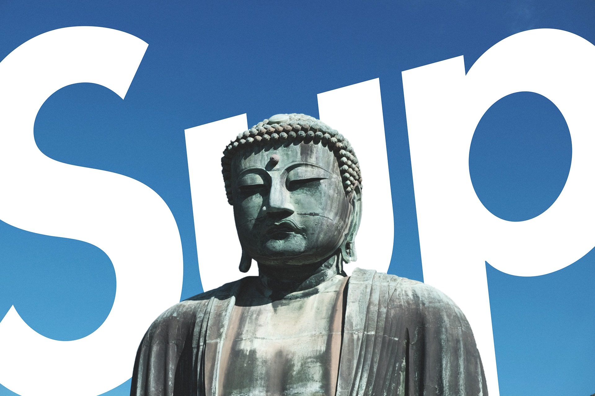 Art picture of a buddha statue in front of a blue sky